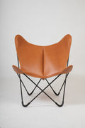 Bonet BKF® butterfly chair by Isist Atelier: black steel frame with a natural leather sling