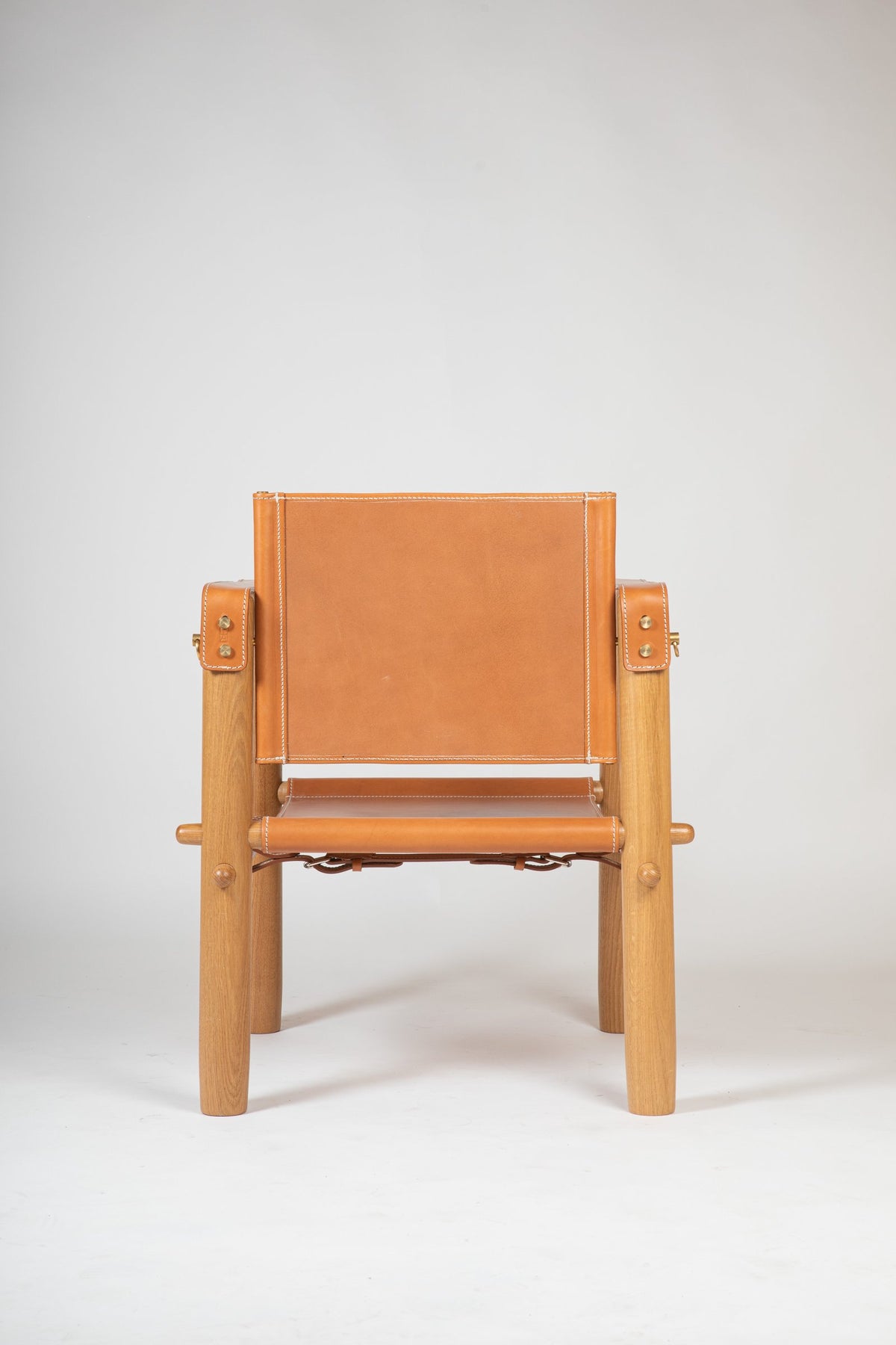 Cubica armchair by Antoni Bonet for Isist Atelier: natural ash frame with tan leather seat, back, and armrests