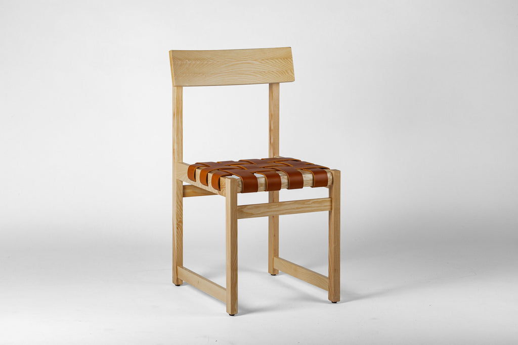 Tiracord chair by Jordi Vilanova for Isist Atelier: natural ash frame with a woven tan leather strip seat