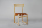 Tiracord chair in natural ash and natural leather, three-quarter view