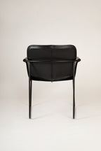 Orma armchair in black leather on a black epoxy frame