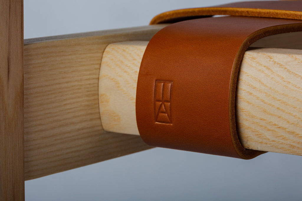 Detail of a leather strap on the Tiracord chair