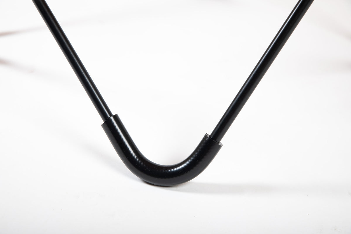Detail of the black steel frame and foot of the Bonet BKF®