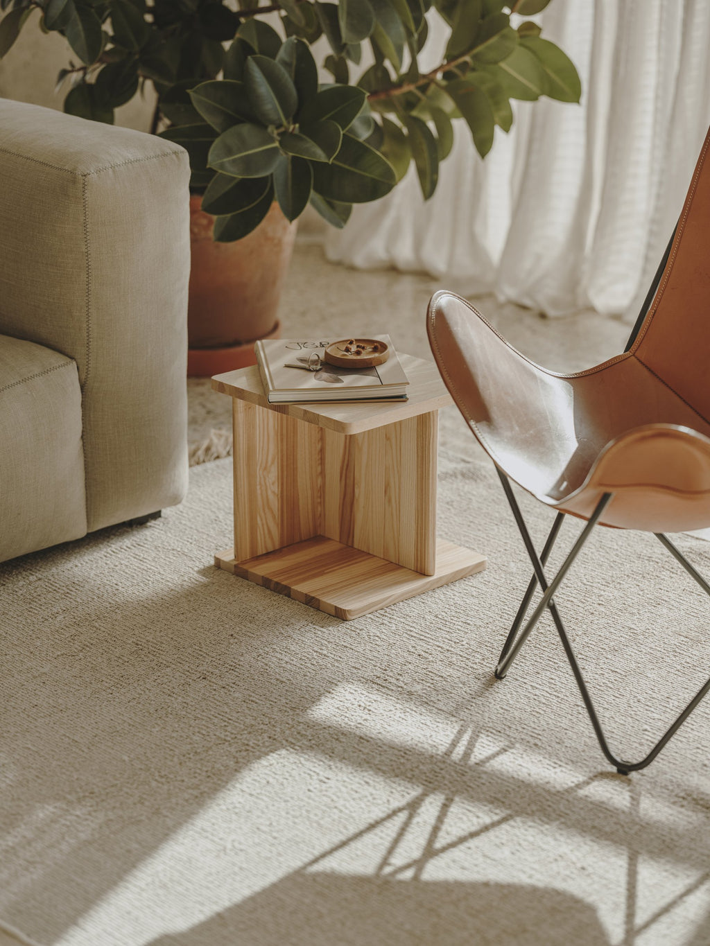 Delta used as a side table beside a chair