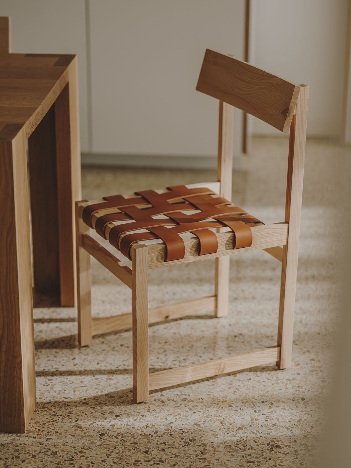 Tiracord chair in a room, side view