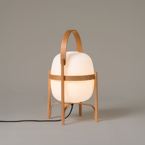 Cesta lamp by Miguel Milá for Santa & Cole in cherry wood with an opal glass globe, switched on