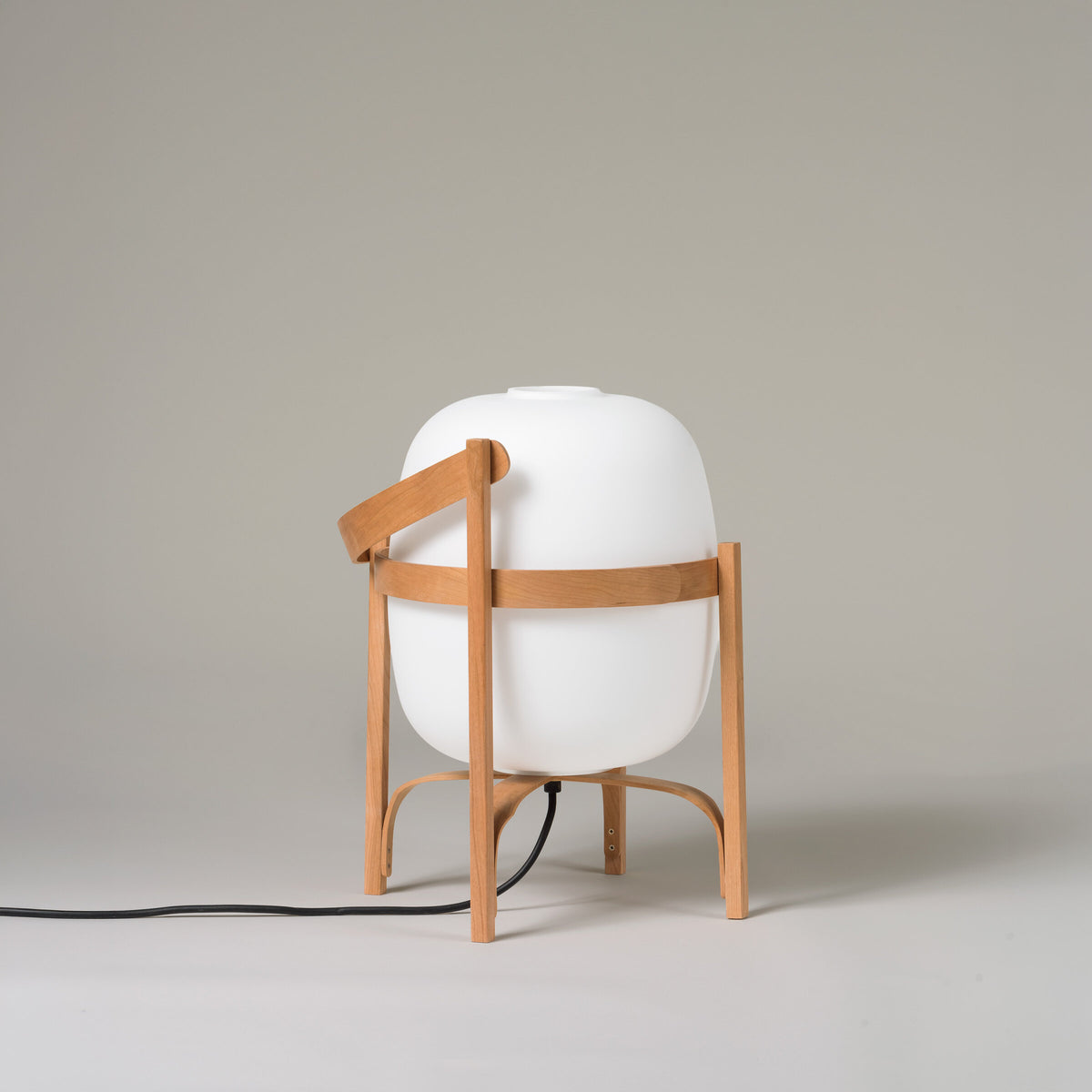 Cesta lamp with its handle folded down, switched off