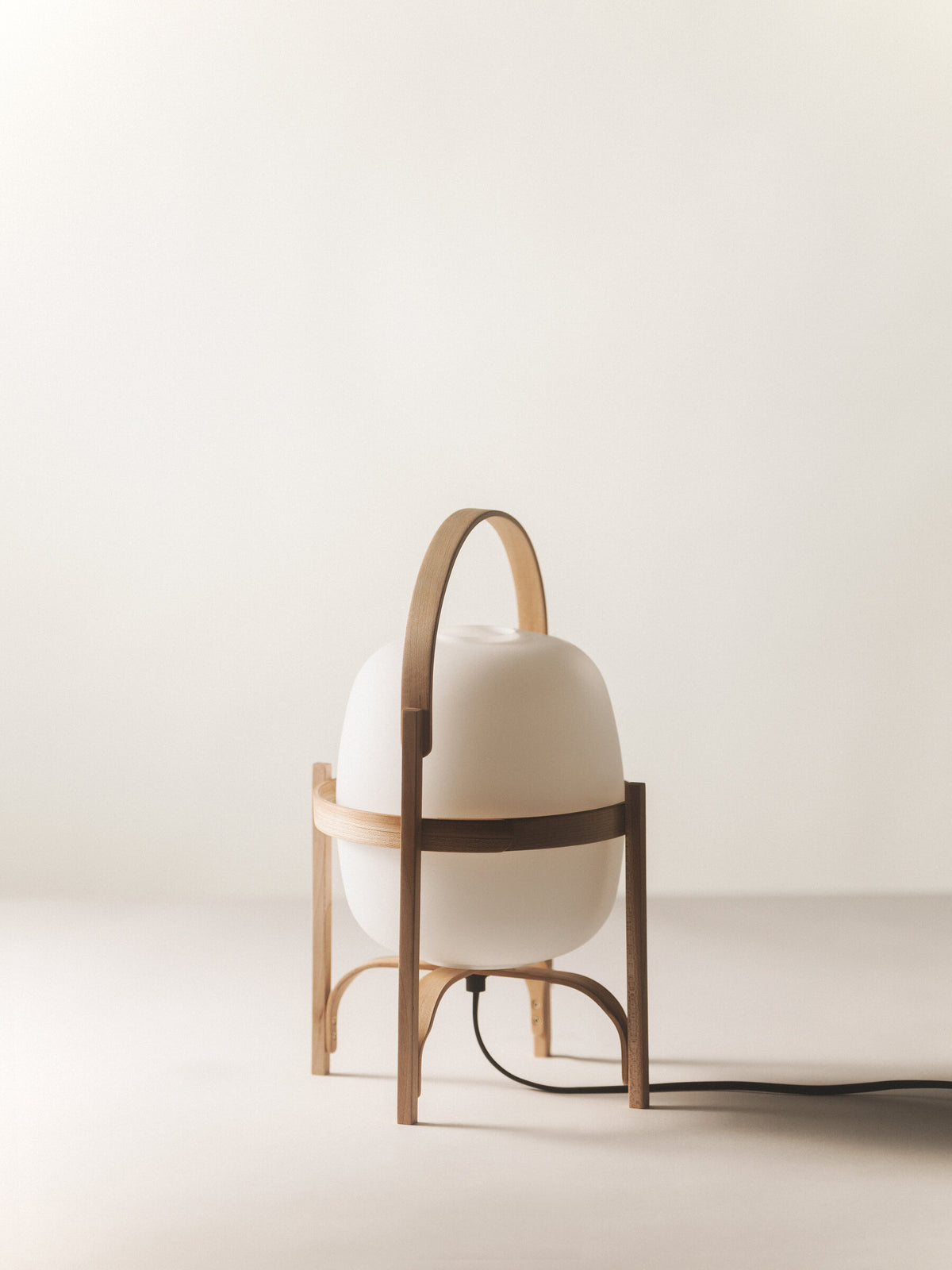 Cestita lamp in cherry wood with an opal globe, switched off