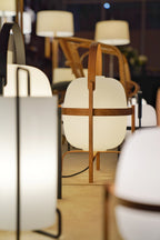 Cestita lamp among other Miguel Milá lamps at an exhibition