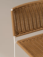Detail of the hand-woven natural rattan seat and back of the Ramón chair