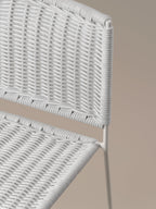 Detail of the hand-woven white rattan seat and back of the Ramón chair