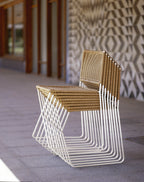 Ramón chairs in natural rattan stacked on top of each other