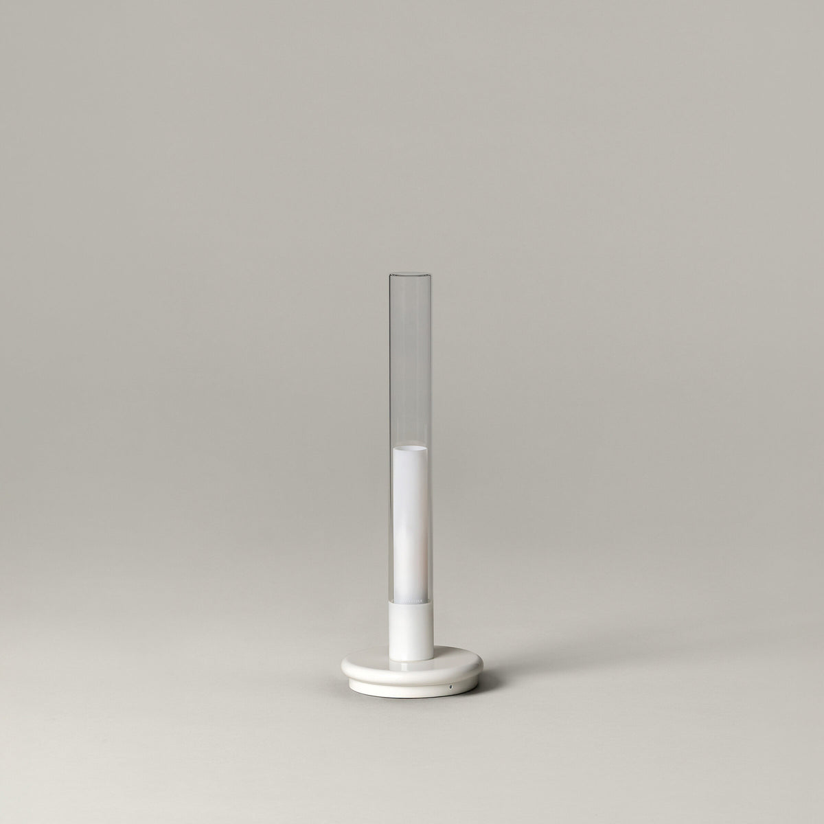 Sylvestrina portable lamp with a white base, switched off