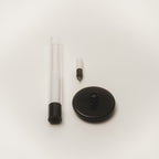 Sylvestrina portable lamp taken apart: glass tube, light source, and base