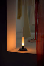 Sylvestrina portable lamp in a lit niche at night